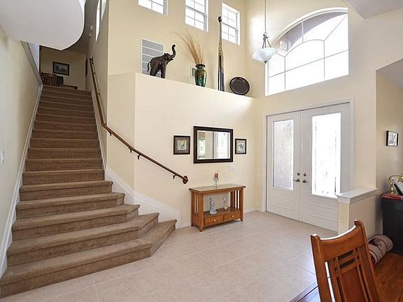 Enter to the large foyer with soaring ceilings and lots of natural light.
