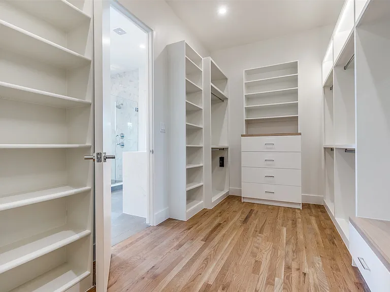 Large primary closet with tons of built-ins