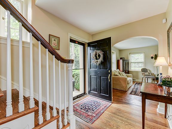 Graceful arched doorways & hardwoods greet you