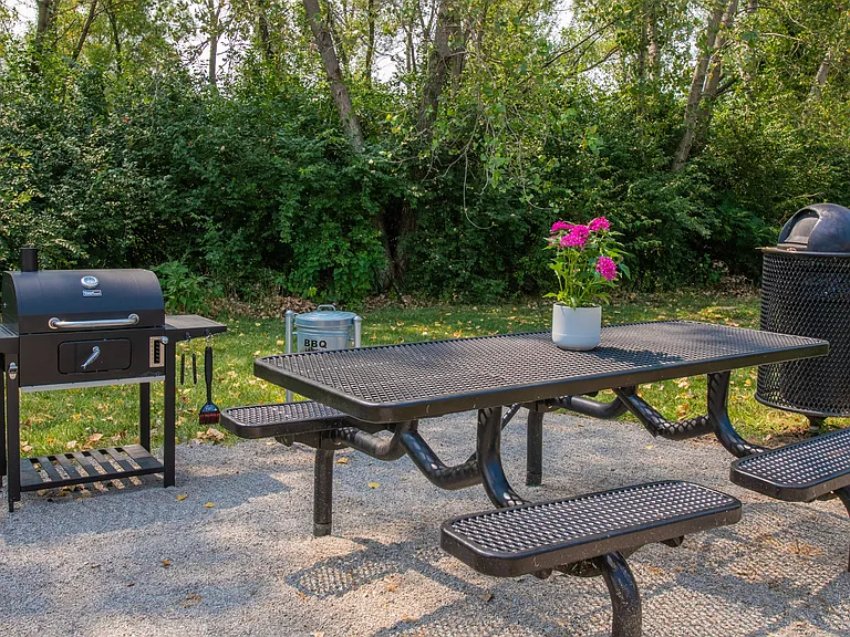 Savor the outdoors and enjoy al fresco dining at our serene BBQ picnic area with charcoal grill to serve up your best grilled masterpiece.