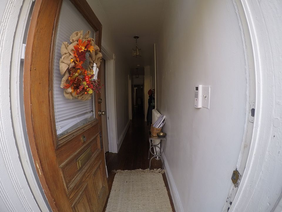As you walk in. Long hallway. Hardwood floors.