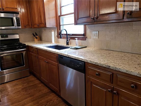 Stainless appliances, granite sink and counters. New cabinetry, with ORB handles and sink faucet.