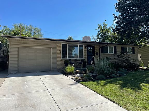 Driveway and garage. There is additional paved parking to left of garage in photo