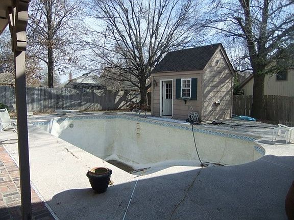 Gunite diving pool was recently resurfaced. Cabana has half bath and storage