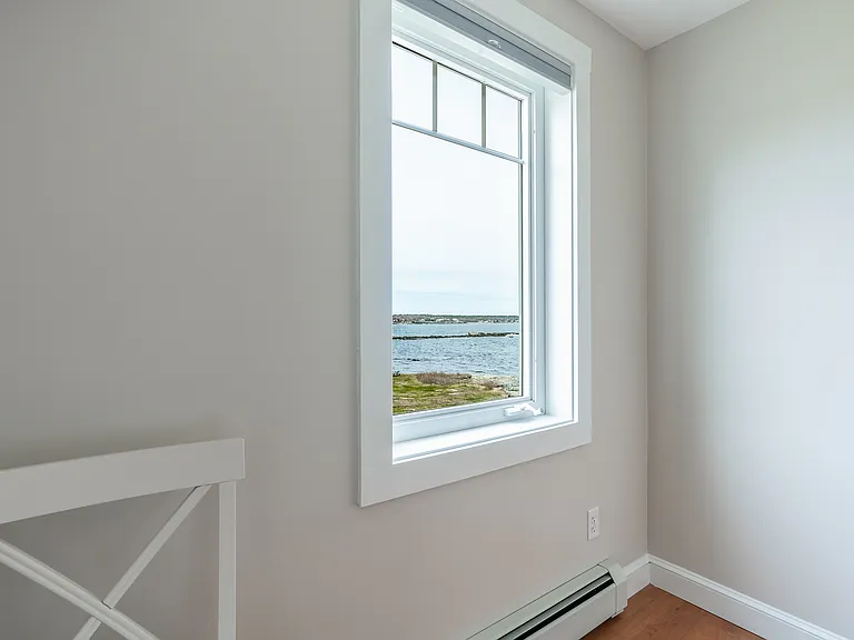 The third floor bedroom with a queen bed. Ocean views.