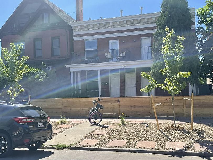 Fenced front patio with beautiful neighboring historic homes