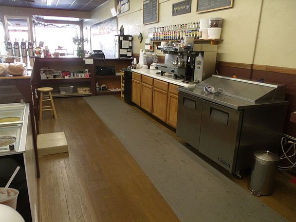 View of Storage & Equipment located behind the counter