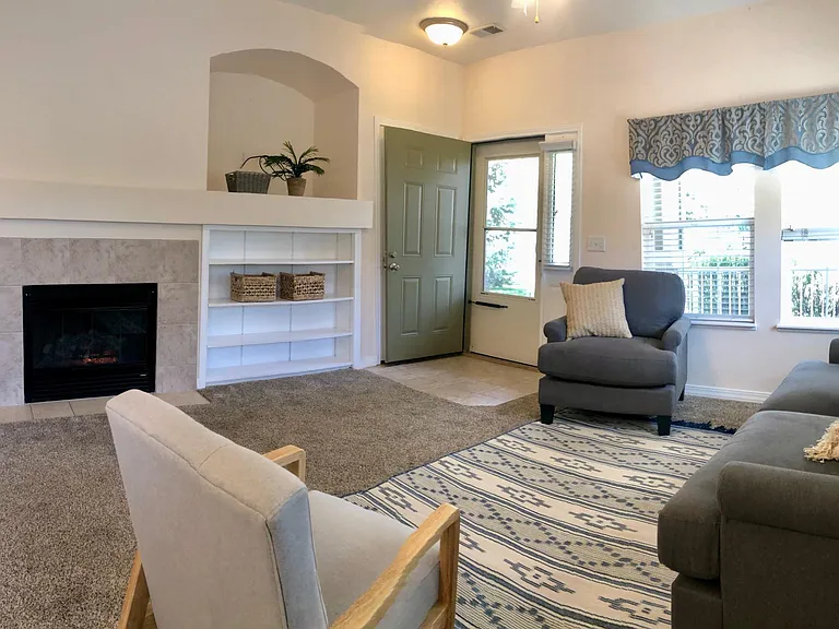 Living room with fireplace plus front entrance