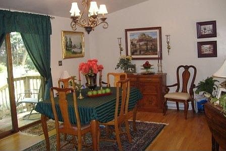 Main Level Dining Room w/Sliders to Private Yards and Gardens
