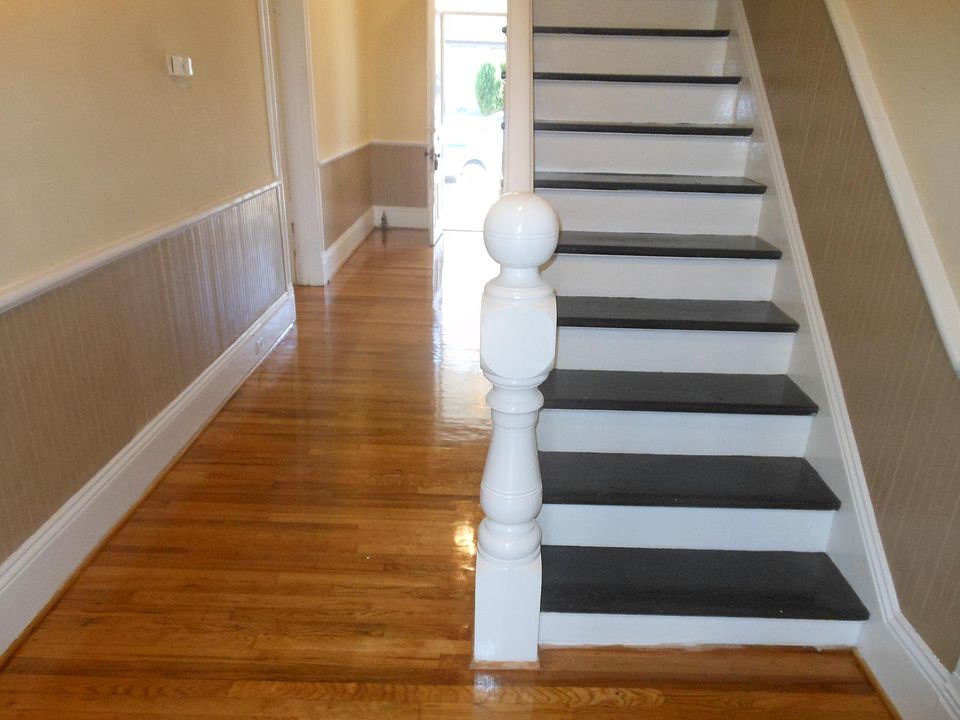Stairway to second floor, two large bedrooms and bath; locked off if desired.