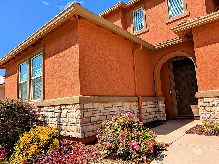 Welcome home to this charming property with beautiful curb appeal. The warm, inviting exterior architecture sets a perfect, welcoming tone for your new home.