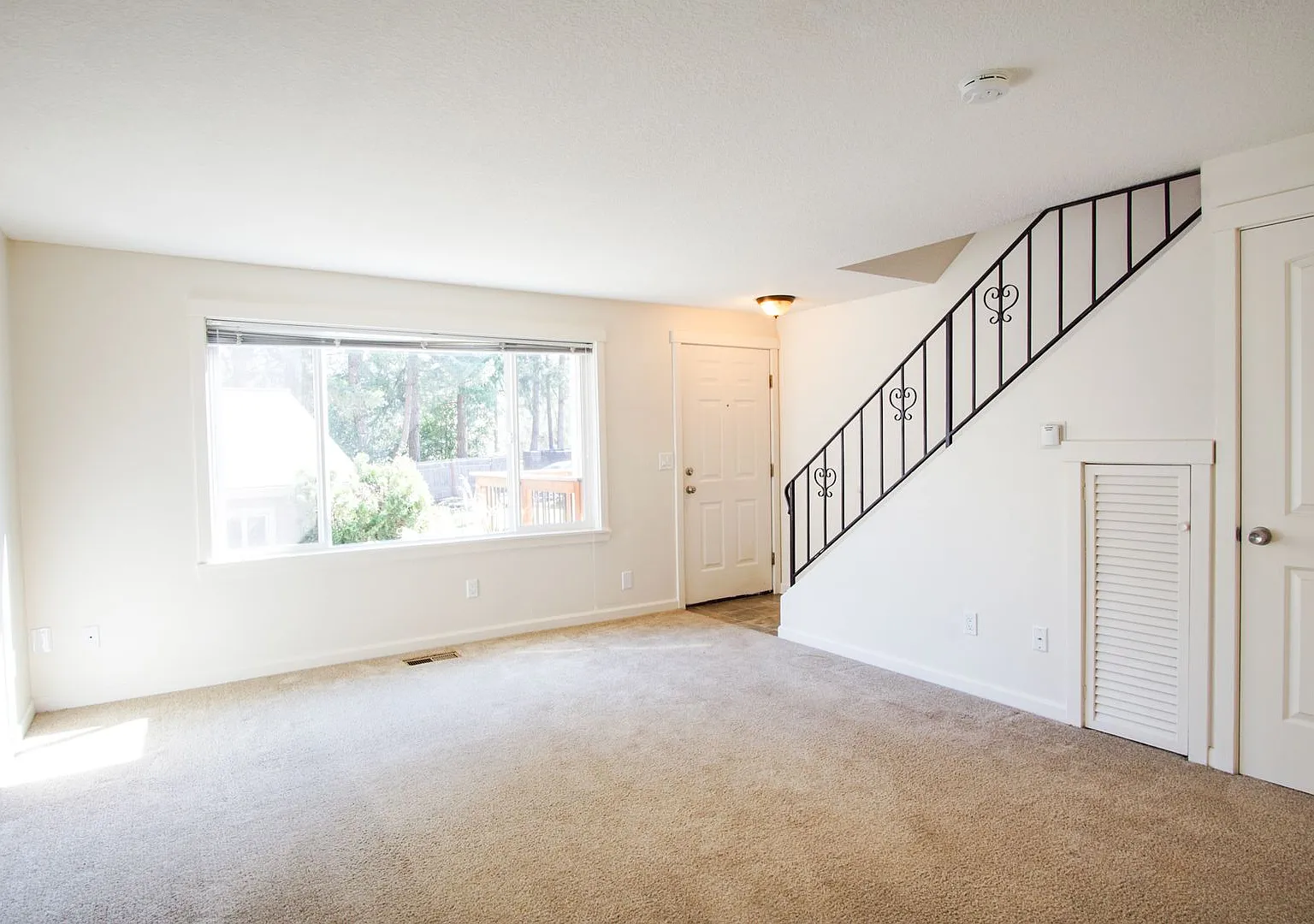 Spacious Corner Townhome with Private Patio + Parking! — Photo 2
