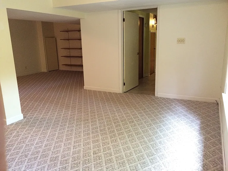 Lower Level features a large living space. Great for an office or recreation room. Lots of Storage!