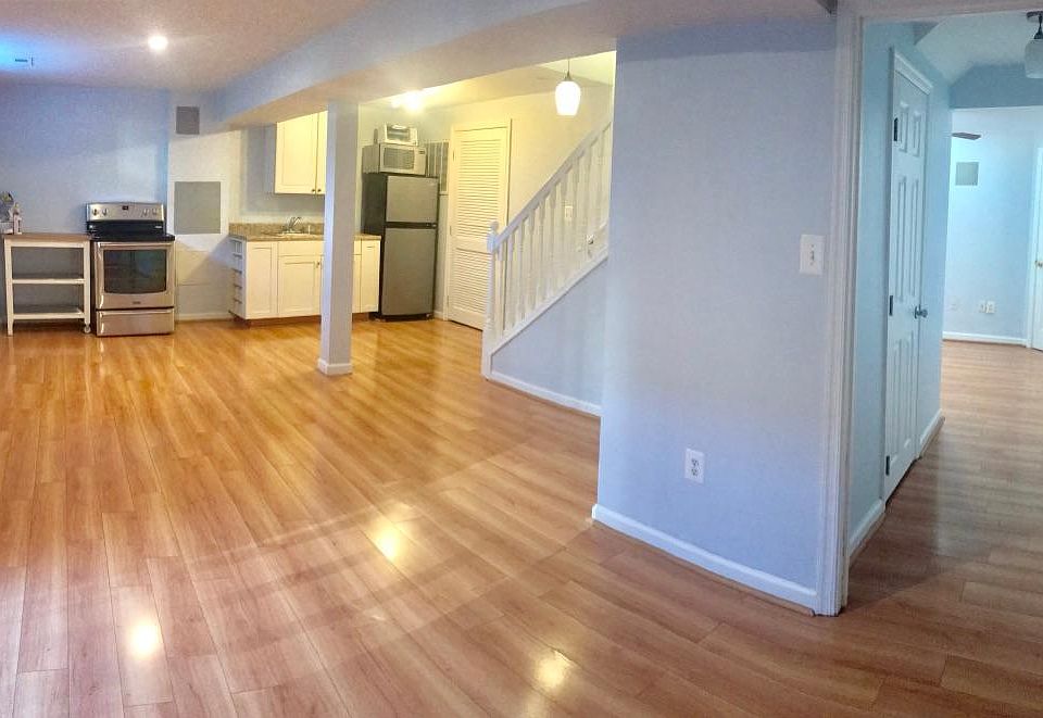Full view of living and kitchen area and bedroom on the right
