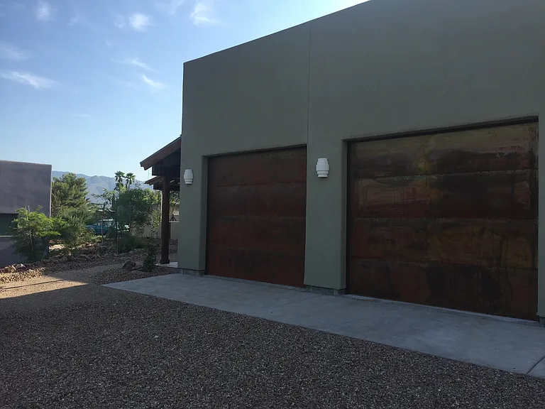 Center garage bay of 3 with washer and dryer in garage along with interior 
door to home
