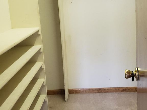 Walk in closet in master bedroom.