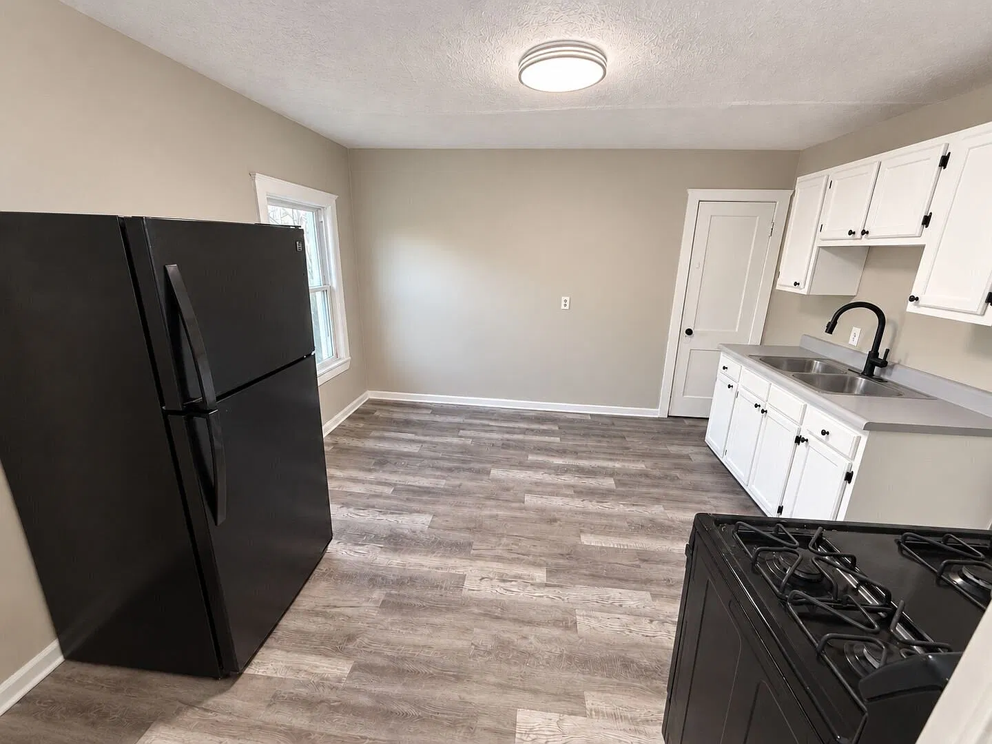 Freshly Updated 3-Bedroom Upper Unit with New Hardwood Floors at 3826 E. 78th St.! — Photo 3