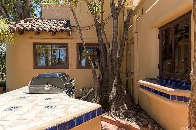 Main patio has a built in BBQ and a passthrough to the kitchen