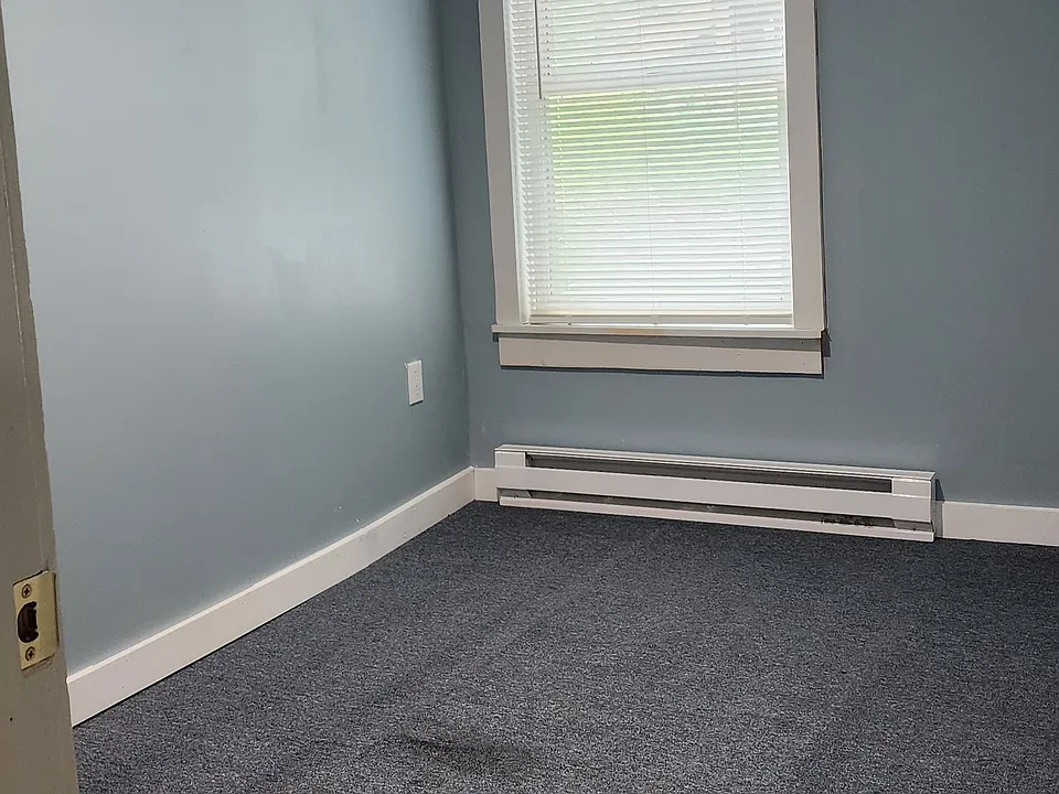 Bedroom - new carpet and new electric baseboard heating