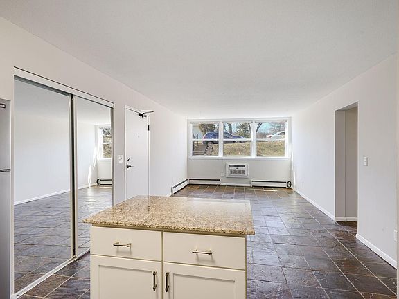 Kitchen looking into dining and living rooms