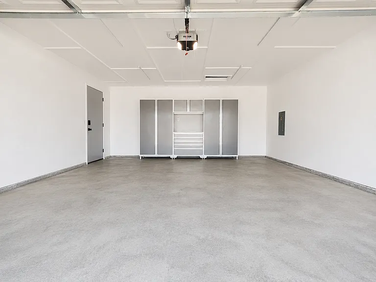 2 car garage with metal storage cabinets