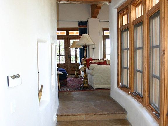 Behind the carved Morelli front door there is a hallway which runs in two directions. To the right i