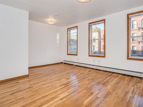 Large Living area with a designated dining area and storage closet! Lots of space!