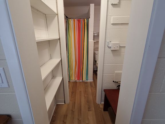 Hallway between the bedroom and bathroom.