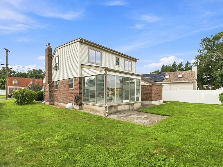 spacious backyard, with sunroom