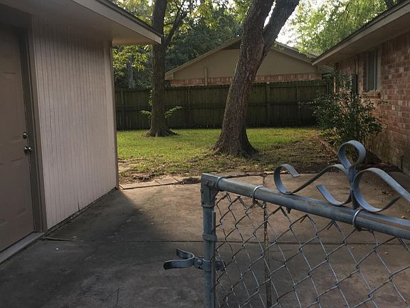 Large backyard on corner lot. Detached garage to left with separate entrance. New garage door openers. Large patio out back. Very private space. Mature trees, shady!