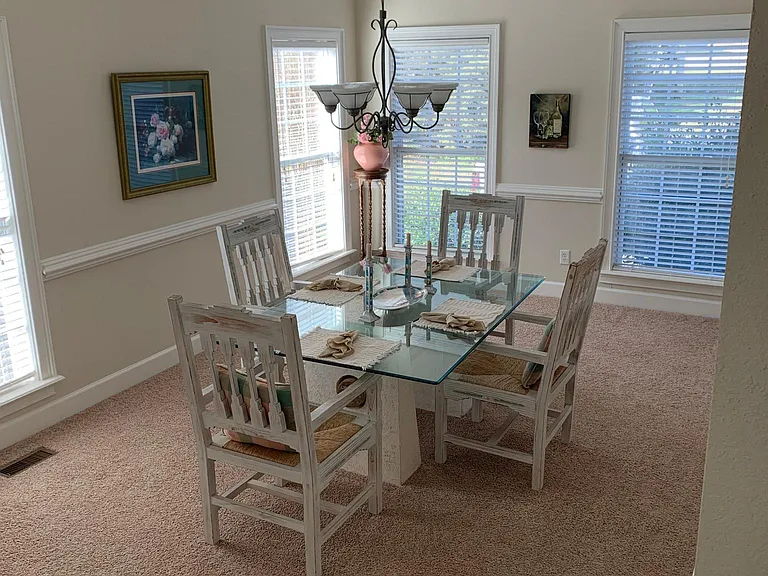 Large dining room, often used as a work space.