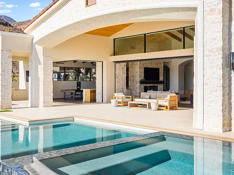 The covered patio features comfortable seating for you to take in the amazing views.