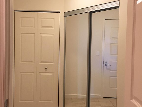 Foyer with washer/dryer and coat closet