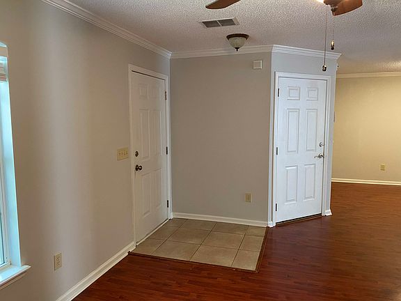 Front door (left) and garage door (right). Taken from living room looking toward dining room