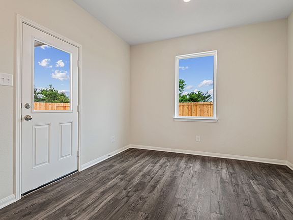 Dining room with a door that leads to the backyard