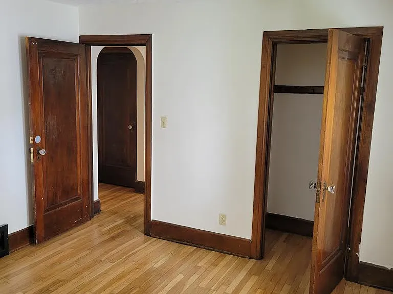 Second bedroom leading to closet and hallway to bathroom and bedrooms.