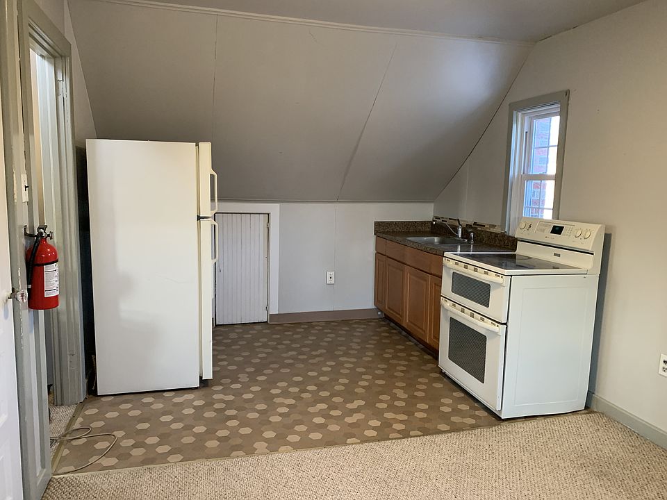 Cozy kitchen with electric stove and dual capacity oven.