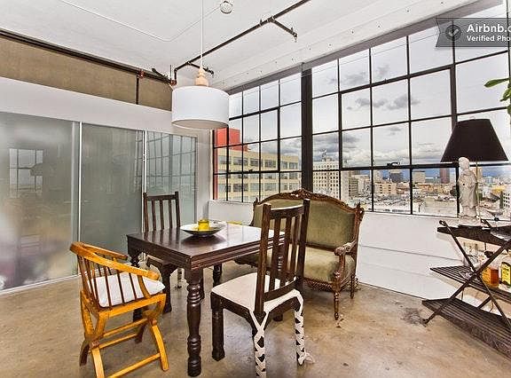 Dining room with sweeping mountain and city view