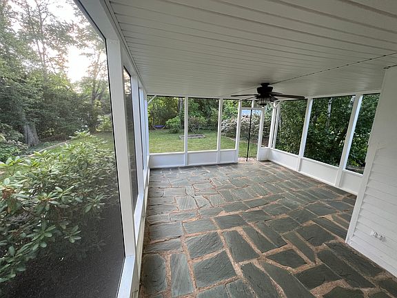 Cool screened in porch with fan, perfect for sipping coffee or entertaining friends.