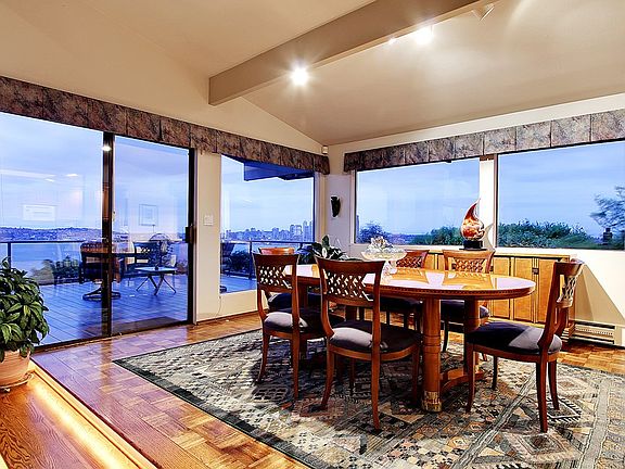 The large dining room with slider to the deck is conveniently located off the kitchen and enjoys ama