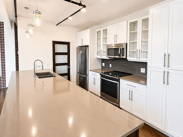 Kitchen featuring stainless steel appliances and an open layout for entertaining.