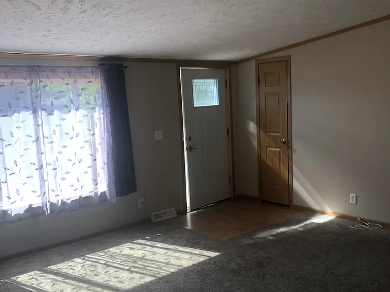 Living Room with Coat Closet