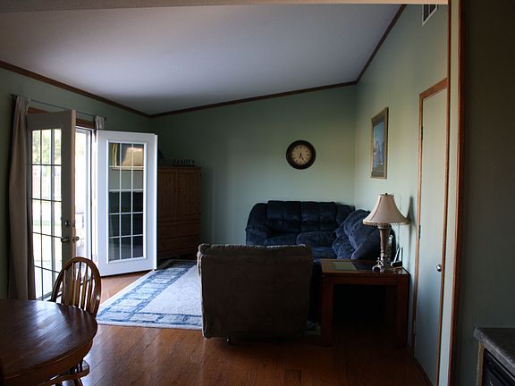 French doors open to fenced yard