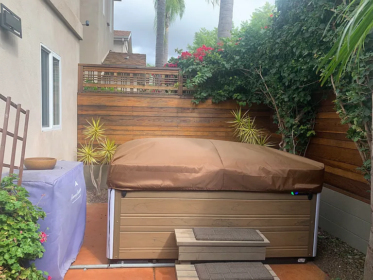 Outside Fenced Private Tropical Patio with Luxurious Hot Tub with Lighting and Bluetooth Speakers