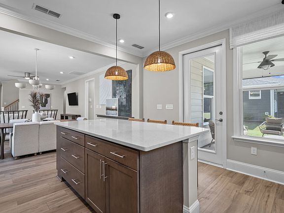 Kitchen Leading to Screened-In Patio. Model Home Representation.
