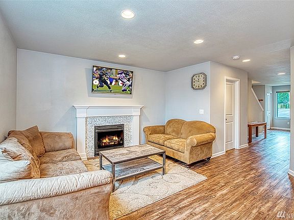 Great room off the dining room. Marble gas fire place.
