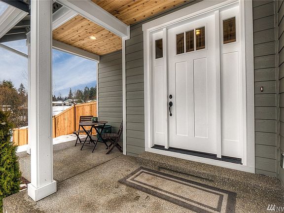 The large covered front porch is a welcoming touch. Spacious enough for lingering over a morning cup of coffee.