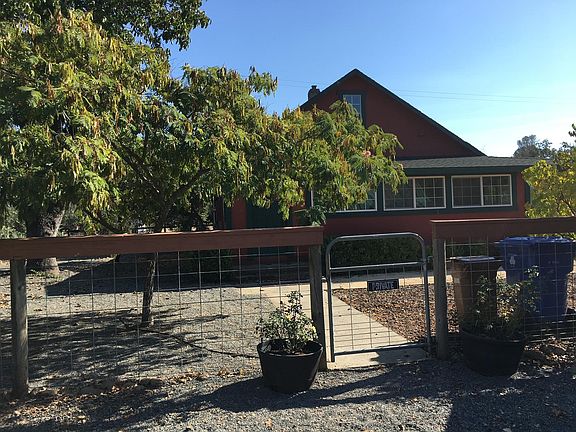 Gated rear entry from designated parking spot to mudroom/laundry porch.