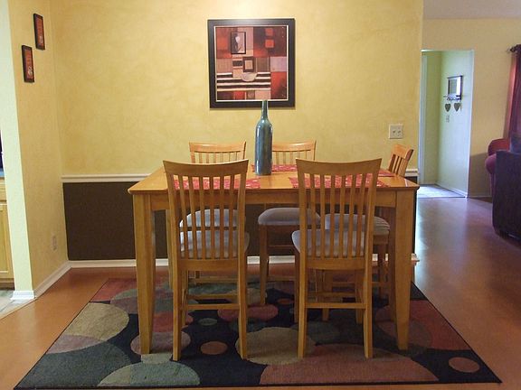 open dining/laminate wood floors