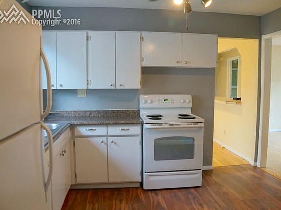 Kitchen opens to the large dining area and living room.